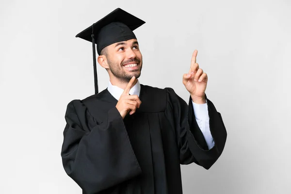 Молодий Випускник Університету Над Ізольованим Білим Тлом Вказуючи Індексний Палець — стокове фото