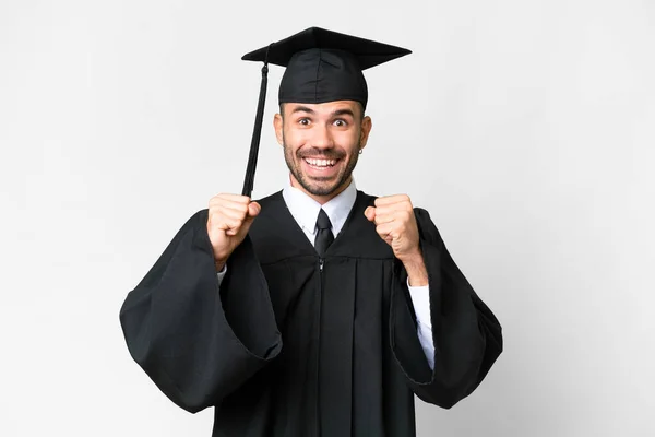 Junger Universitätsabsolvent Vor Isoliertem Weißen Hintergrund Feiert Sieg Siegerpose — Stockfoto