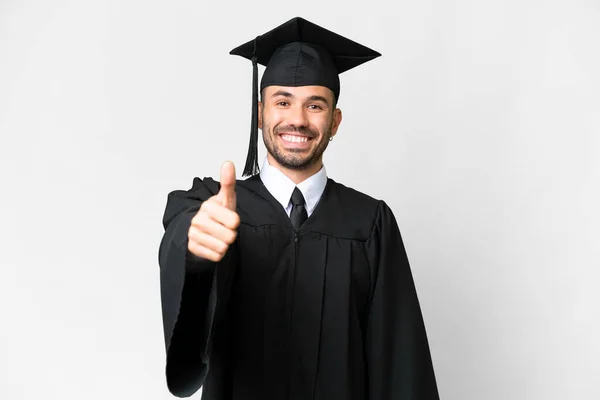Jovem Universitário Graduado Homem Sobre Isolado Branco Fundo Com Polegares — Fotografia de Stock