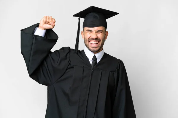 Νεαρός Απόφοιτος Πανεπιστημίου Πάνω Από Απομονωμένο Λευκό Φόντο Κάνει Ισχυρή — Φωτογραφία Αρχείου
