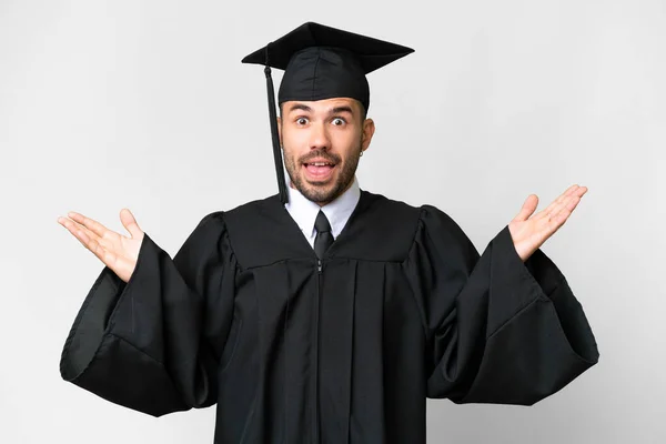 Jovem Universitário Graduado Homem Sobre Isolado Branco Fundo Com Chocado — Fotografia de Stock