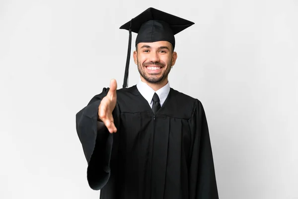 Jonge Universiteit Afgestudeerde Man Geïsoleerde Witte Achtergrond Schudden Handen Voor — Stockfoto