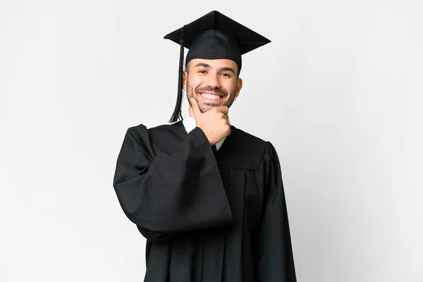 Junger Universitätsabsolvent Lächelt Über Isolierten Weißen Hintergrund — Stockfoto