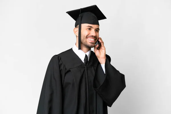 若い大学院生男以上隔離された白い背景誰かと携帯電話との会話を保つ — ストック写真