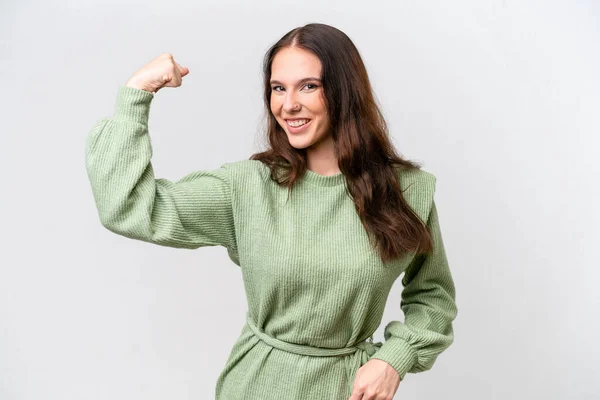 stock image Young caucasian woman isolated on white background doing strong gesture