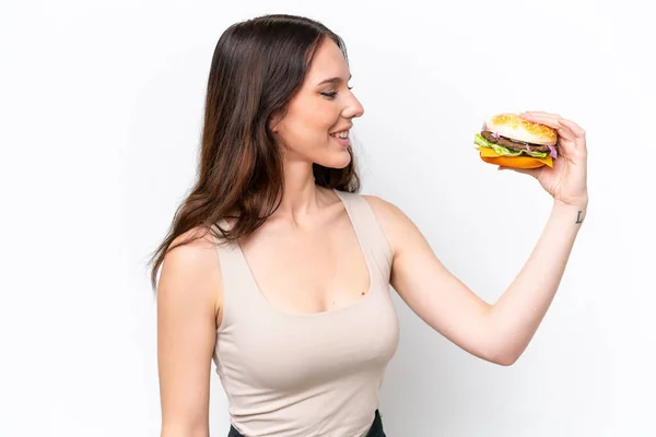 Young Caucasian Woman Holding Burger Isolated White Background Happy Expression — Stock Photo, Image