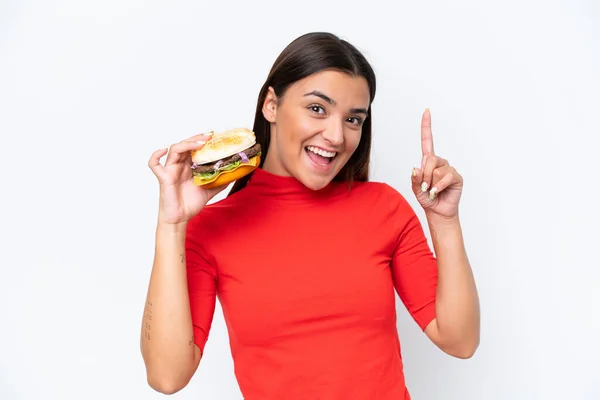 Young Caucasian Woman Holding Burger Isolated White Background Pointing Great — Photo