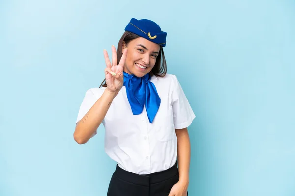 飛行機スチュワーデス原因アジアの女性は幸せな青の背景に隔離され 指で3を数える — ストック写真