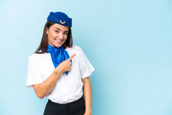 Airplane Stewardess Caucasian Woman Isolated Blue Background Pointing Side Present — Stock Photo, Image