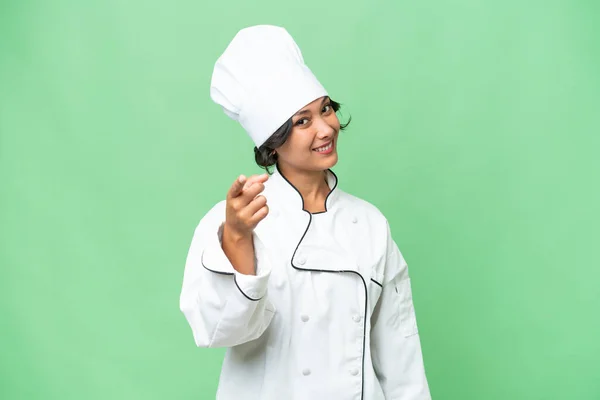 Junge Argentinische Köchin Mit Isoliertem Hintergrund Zeigt Mit Selbstbewusstem Gesichtsausdruck — Stockfoto
