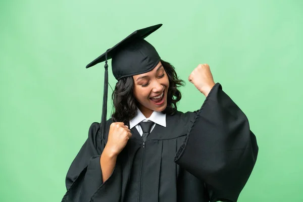 stock image Young university graduate Argentinian woman over isolated background celebrating a victory
