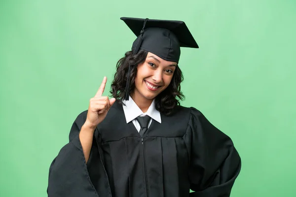 Młoda Absolwentka Uniwersytetu Argentyńskiego Kobieta Odosobnionym Tle Pokazując Podnosząc Palec — Zdjęcie stockowe
