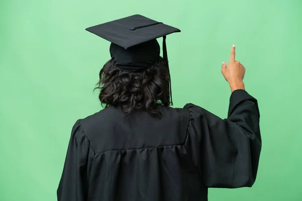 Junge Universitätsabsolventin Argentinierin Über Isolierten Hintergrund Zeigt Mit Dem Zeigefinger — Stockfoto