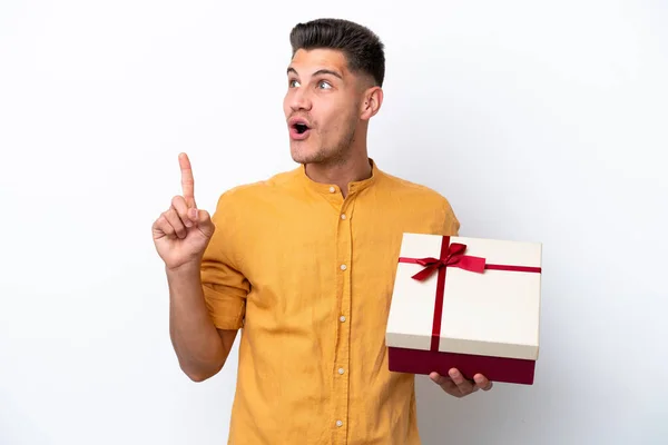 Young Caucasian Man Holding Gift Isolated White Background Intending Realizes — Stock Photo, Image