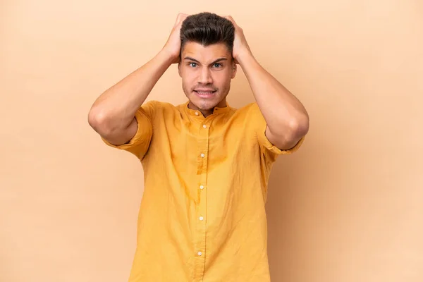 Young Caucasian Man Isolated Beige Background Doing Nervous Gesture — стоковое фото