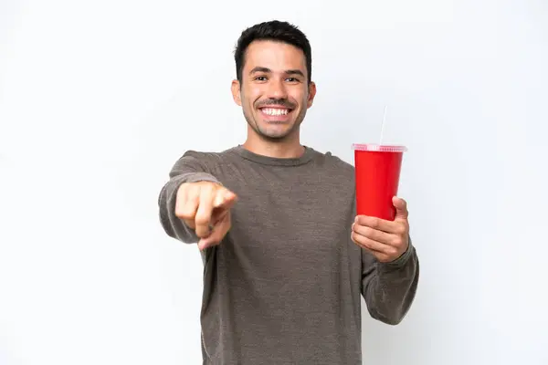 Young Handsome Man Holding Soda Isolated White Background Points Finger — 스톡 사진
