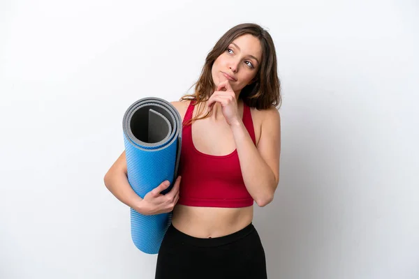 Young Sport Caucasian Woman Going Yoga Classes While Holding Mat — стоковое фото