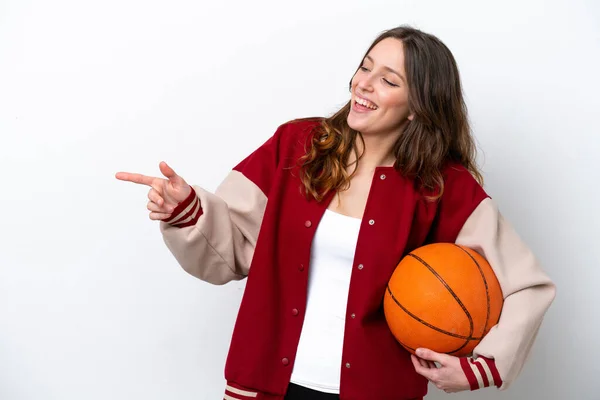 Young Caucasian Woman Playing Basketball Isolated White Background Pointing Finger — Stock fotografie