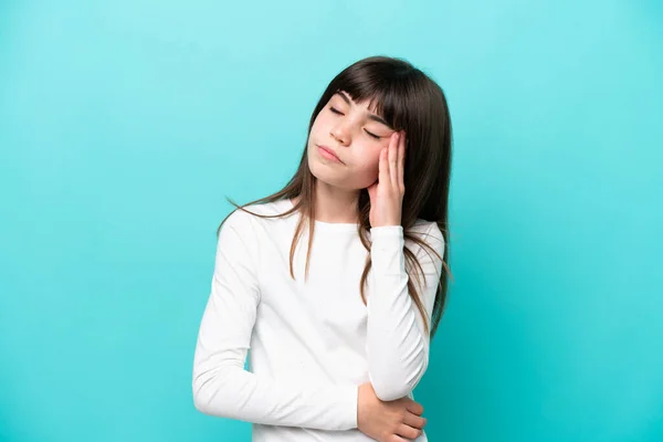 stock image Little caucasian girl isolated on blue background with headache