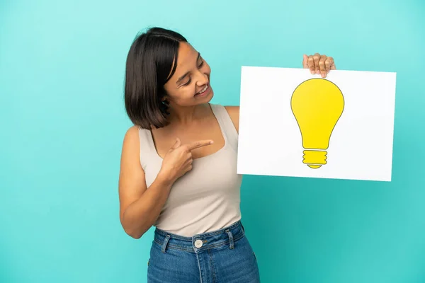 Young Mixed Race Woman Isolated Blue Background Holding Placard Bulb — Stock Photo, Image