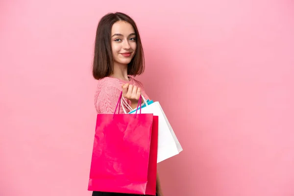 Young Ukrainian Woman Isolated Pink Background Holding Shopping Bags Smiling — стокове фото
