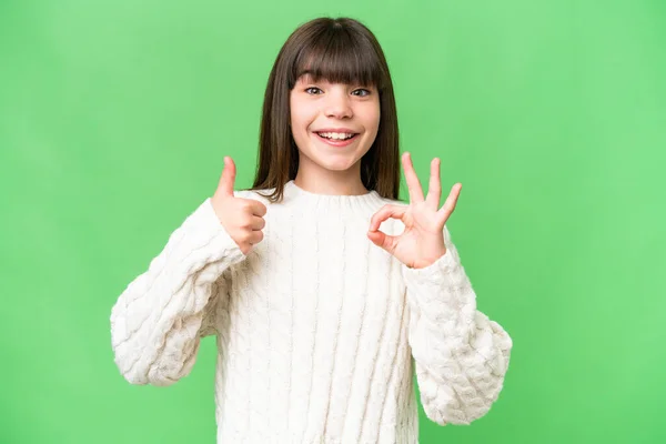 stock image Little caucasian girl over isolated background showing ok sign and thumb up gesture