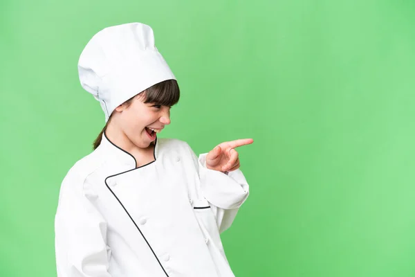 Pequeña Chica Chef Caucásica Sobre Fondo Aislado Señalando Dedo Hacia — Foto de Stock