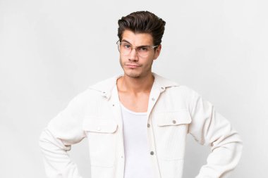 Young handsome caucasian man over isolated white background angry