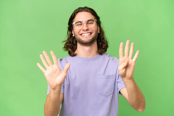 Mladý Pohledný Muž Přes Izolované Pozadí Počítání Devět Prsty — Stock fotografie