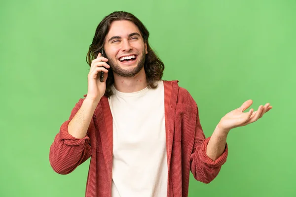 Young Handsome Man Isolated Background Keeping Conversation Mobile Phone Someone — Stock Photo, Image