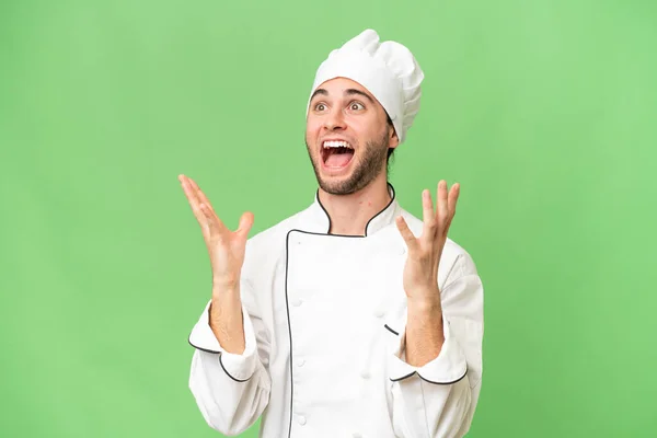 Jonge Knappe Chef Kok Man Geïsoleerde Achtergrond Met Verrassing Gezicht — Stockfoto