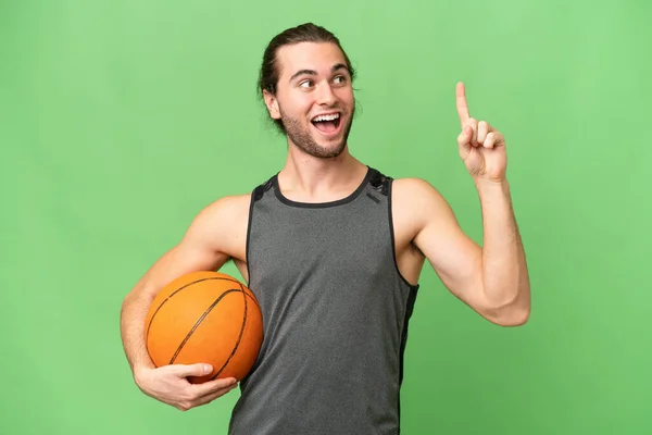 Young Handsome Man Isolated Green Chroma Background Playing Basketball Having — Stock Photo, Image