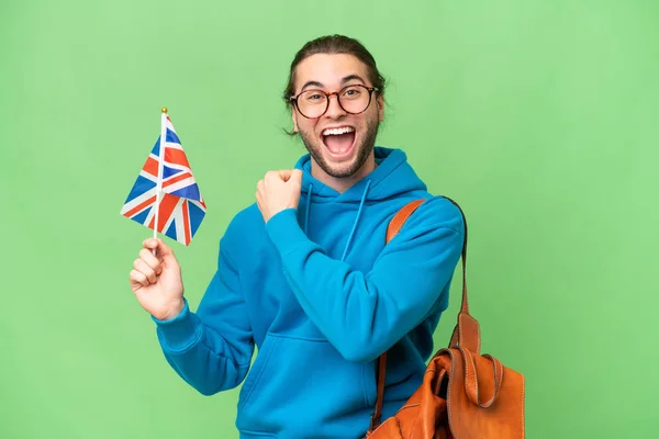 Joven Hombre Guapo Sosteniendo Una Bandera Del Reino Unido Sobre —  Fotos de Stock
