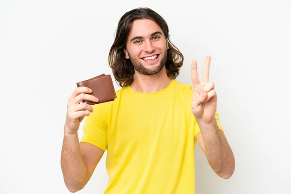 Mladý Pohledný Muž Drží Peněženku Izolované Bílém Pozadí Úsměvem Ukazuje — Stock fotografie