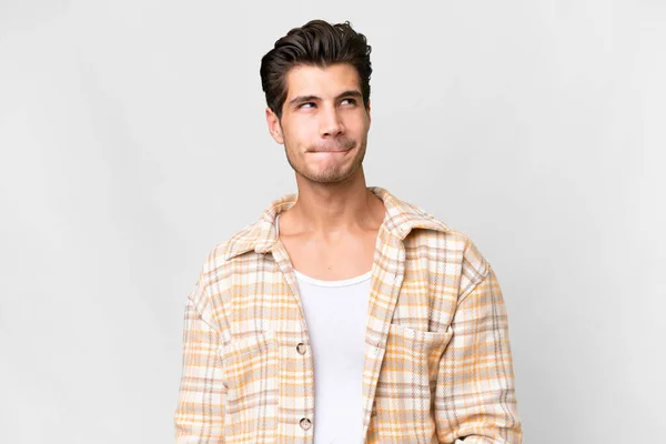 Young Handsome Caucasian Man Isolated White Background Having Doubts While — Stock Fotó