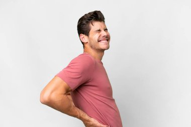 Young handsome caucasian man over isolated white background suffering from backache for having made an effort
