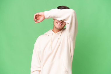 Young caucasian handsome man over isolated background covering eyes by hands
