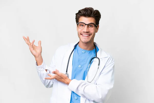 Young Doctor Man Isolated White Background Extending Hands Side Inviting — Stock Photo, Image