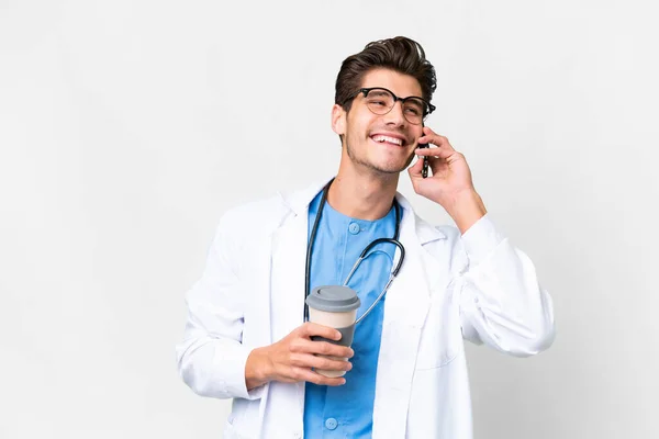 Young Doctor Man Isolated White Background Holding Coffee Take Away — Stock Photo, Image