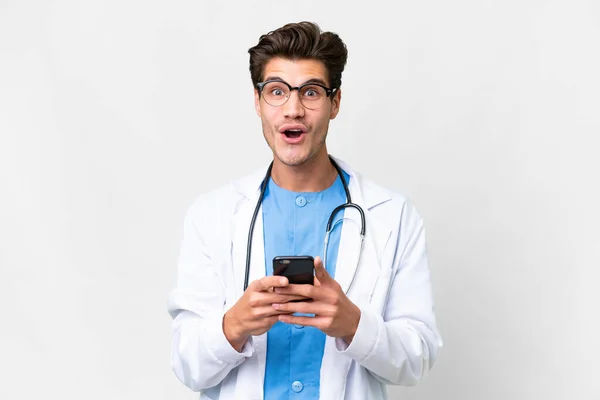 Young Doctor Man Isolated White Background Surprised Sending Message —  Fotos de Stock