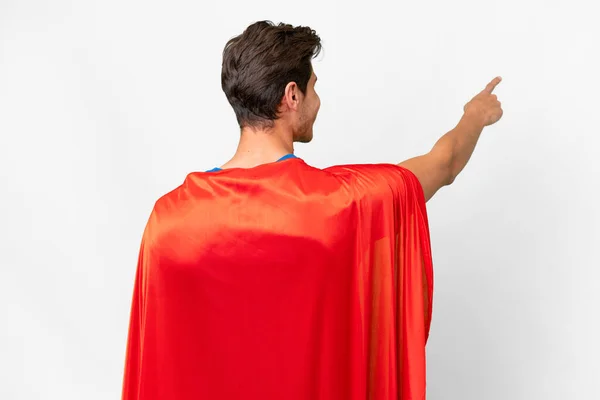 スーパーヒーローCaucasian男上の隔離されたホワイトバックポインティングバックとともにザIndex指 — ストック写真