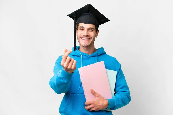 stock image Young university graduate man over isolated white background making money gesture