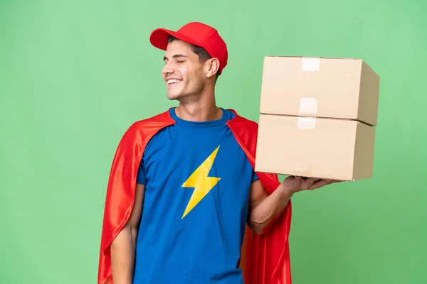 Super Hero Delivery Man Isolated Background Laughing Lateral Position — 스톡 사진
