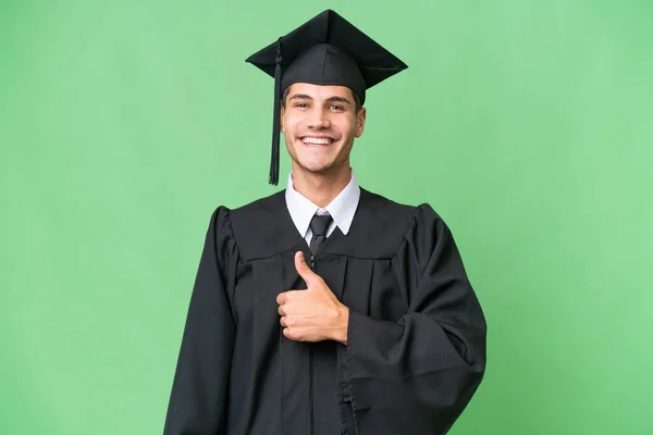 Jovem Universidade Pós Graduação Caucasiano Homem Sobre Isolado Fundo Dando — Fotografia de Stock