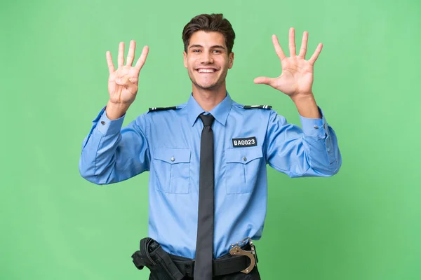Jovem Policial Sobre Fundo Isolado Contando Nove Com Dedos — Fotografia de Stock