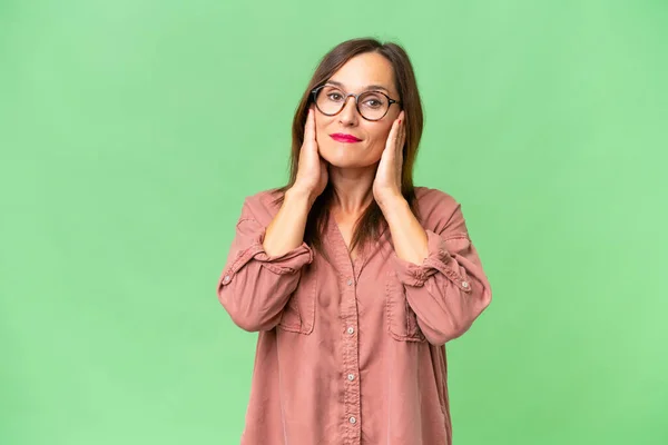 stock image Middle-aged caucasian woman over isolated background frustrated and covering ears