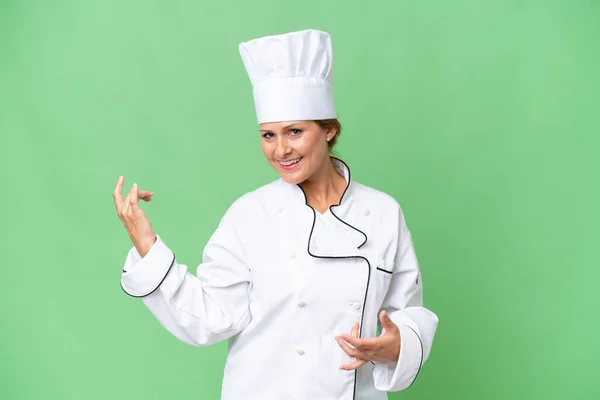 Middle Aged Chef Woman Isolated Background Making Guitar Gesture — Stock Photo, Image