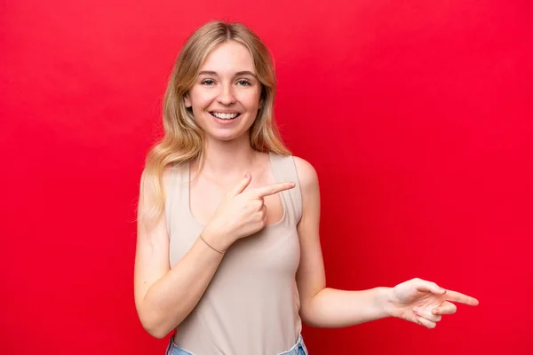 Young English Woman Isolated Red Background Surprised Pointing Side — Stock Fotó