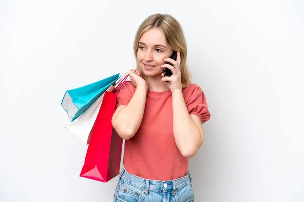 Young English Woman Isolated White Background Holding Shopping Bags Calling — Stok fotoğraf