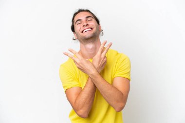 Caucasian handsome man isolated on white background smiling and showing victory sign